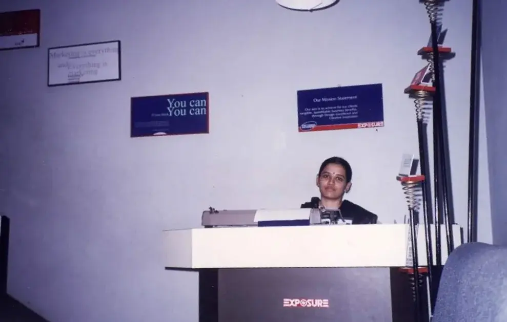 The Exposure reception in the 1990s, with the studio's mission statement on the wall