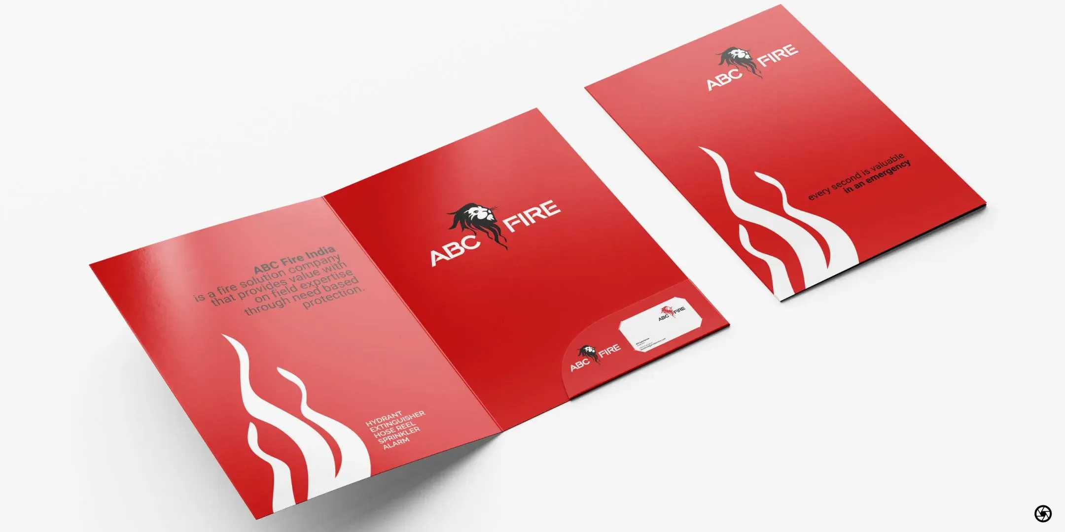 ABC Fire - presentation folder flat-lay showing the spine spread with HYDRANT · EXTINGUISHER · HOSE REEL · SPRINKLER · ALARM listed on the inner flap