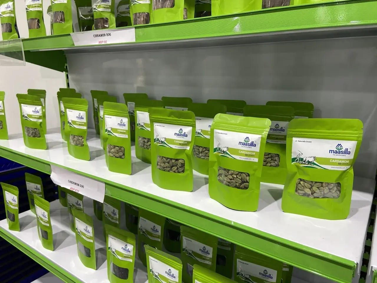 Maasilla cardamom pouches on shelf - 50g resealable green packs with clear window