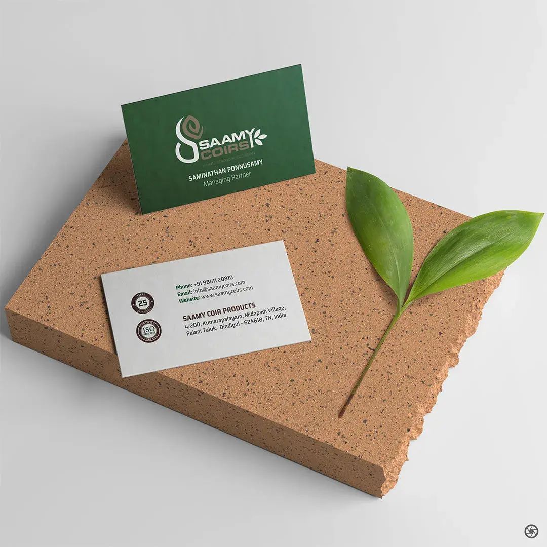 Saamy Coirs business card — forest green face with white mark, white reverse with contact details