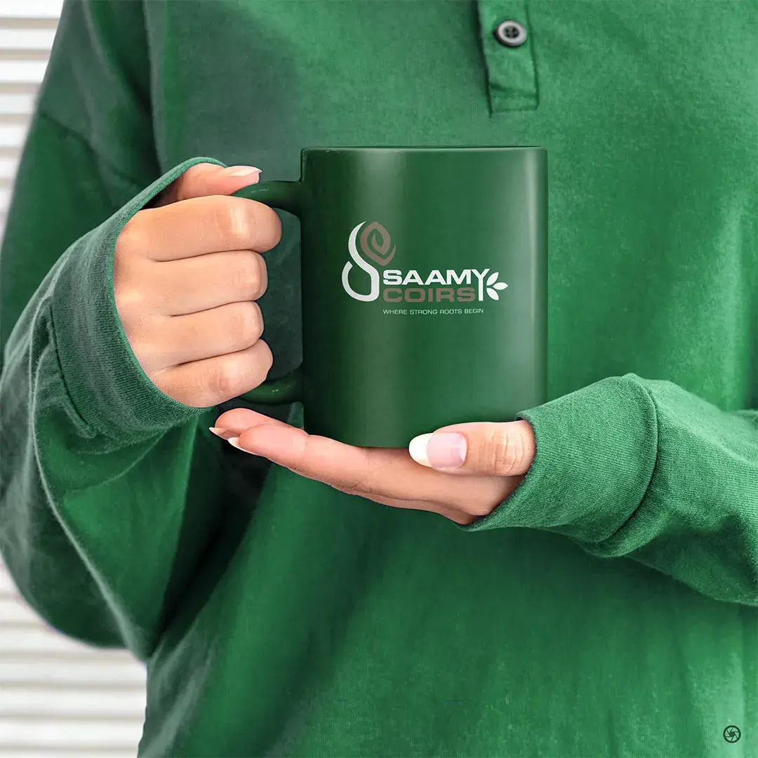 Saamy Coirs branded mug — forest green with white mark