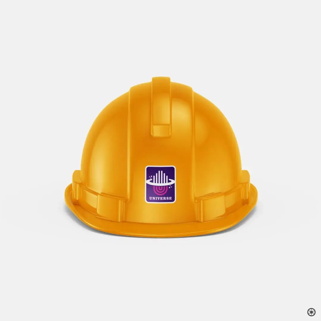 Universe Constructions - second hard hat angle showing the brand decal applied across hats issued to the site team