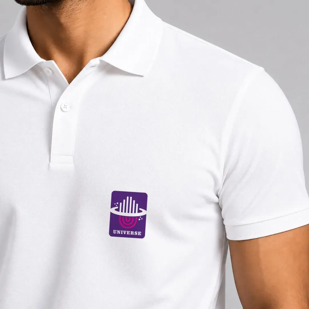 Universe Constructions - white staff polo with the brand chip applied as a chest patch, worn for client visits and the office floor